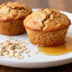 Fluffy air fryer oatmeal muffins made with wholesome oats and served with a drizzle of honey