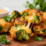 Crispy air fryer broccoli cheese bites with melted cheddar cheese and tender broccoli centers