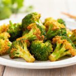 Asian style air fryer broccoli with crispy roasted edges and a savory flavorful seasoning