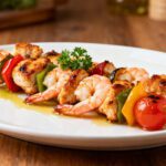 Air fryer chicken and shrimp kabobs with juicy grilled chicken, tender shrimp, and colorful vegetables on skewers