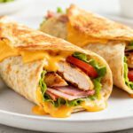 Air fryer chicken ham and cheese wraps filled with juicy chicken, savory ham, crisp lettuce, and melted cheddar cheese