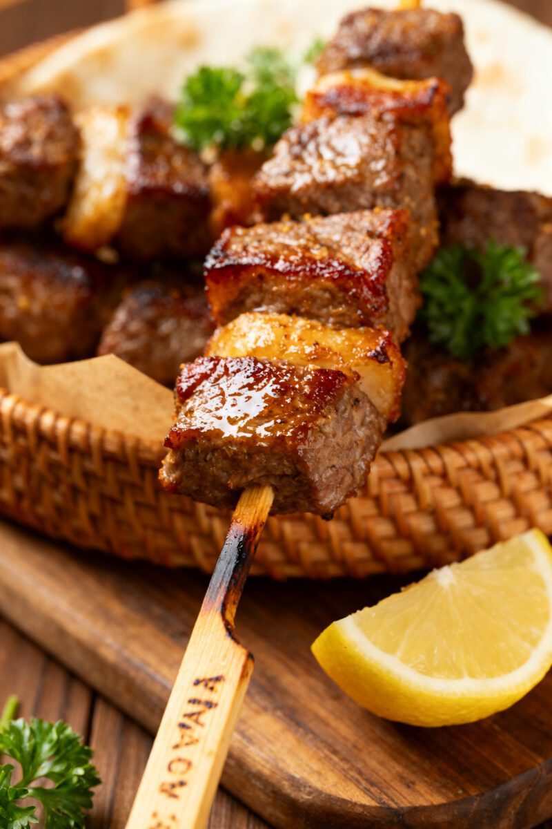 Close-up detail: Juicy air-fried beef kabob just out of the basket, showing caramelized edges on