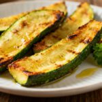 Air fryer zucchini wedges with crispy golden edges, tender centers, and a light herb seasoning