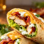 Air fryer chicken bacon ranch wrap filled with juicy chicken, crispy bacon, melted cheese, lettuce, and creamy ranch dressing