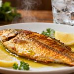 Easy air fryer tilapia with crispy golden skin, tender flaky fish, and fresh lemon wedges
