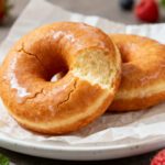 Air fryer no yeast donuts with a soft fluffy texture and sweet vanilla glaze on top