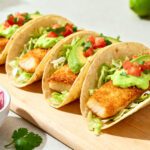 Air fryer tilapia tacos with crispy fish, creamy avocado, shredded lettuce, and fresh pico de gallo