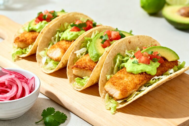Air fryer tilapia tacos with crispy fish, creamy avocado, shredded lettuce, and fresh pico de gallo