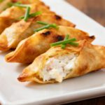 Air fryer crab cream cheese wontons with a crispy golden wrapper and creamy crab and cream cheese filling