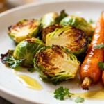 Air fryer Brussels sprouts and carrots with crispy roasted vegetables, caramelized edges, and fresh herb garnish