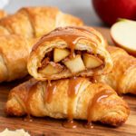 Air fryer apple crescent rolls with flaky golden pastry, warm cinnamon apple filling, and a sweet caramel drizzle, served as an easy homemade dessert.