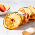 Air fryer fruit chips made with thinly sliced apples and citrus fruit, dried until light and crispy, and naturally sweet for a healthy homemade snack.