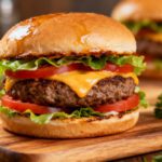 Easy air fryer burger with a juicy beef patty, melted cheddar cheese, fresh lettuce, tomato slices, and a toasted bun, served as a classic comfort food meal.