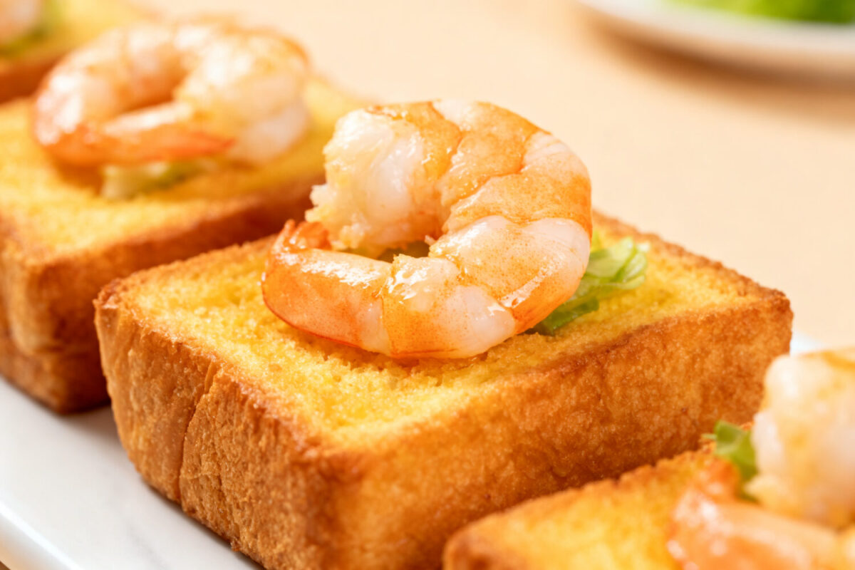 Air fryer shrimp toast with crispy golden toasted bread, tender juicy shrimp, and a light savory topping, served as a quick appetizer or snack with a crunchy texture and seafood flavor.