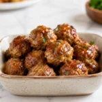 Air fryer pork bites with a crispy golden coating, juicy pork center, and sweet savory glaze