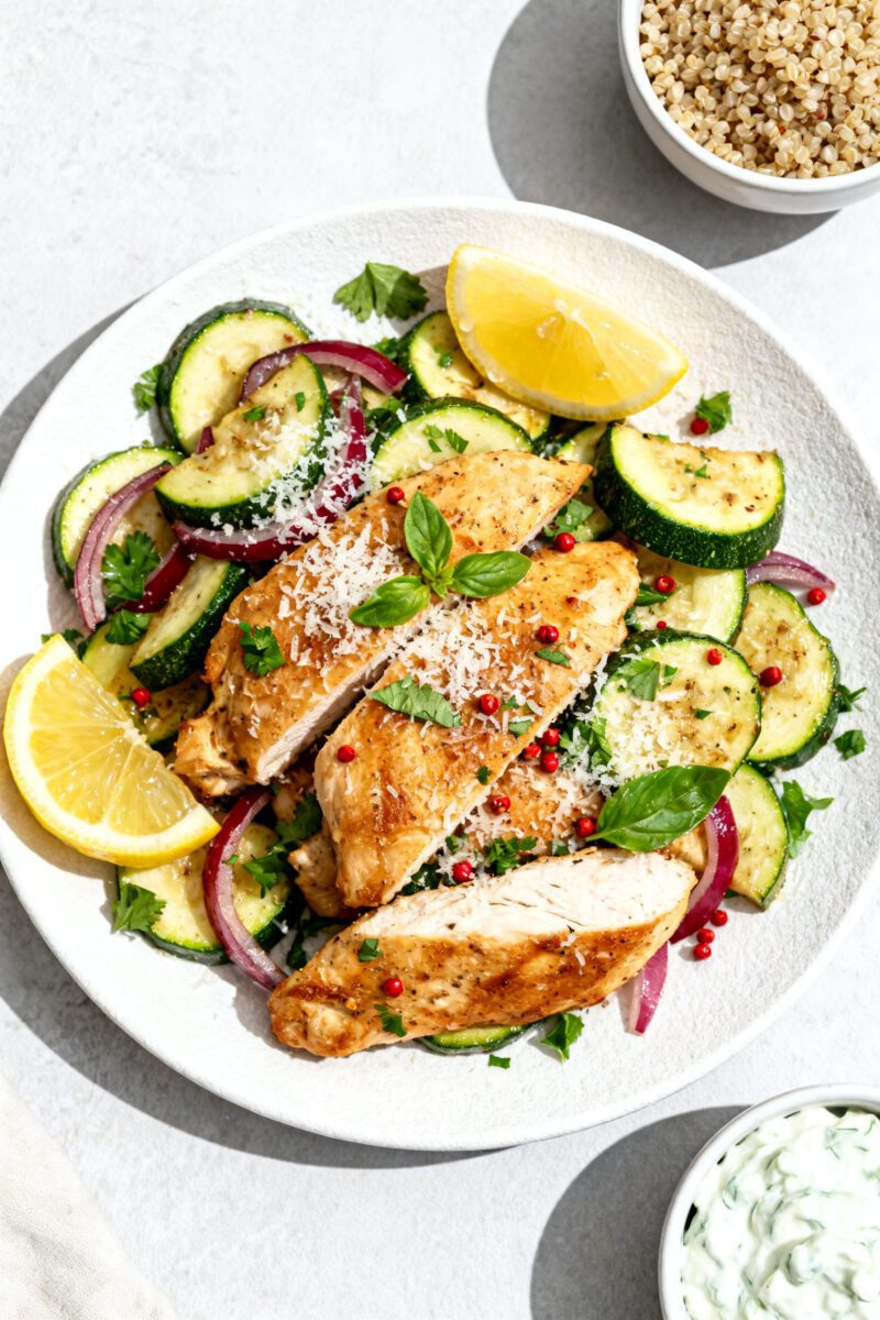 Tasty top view, overhead: Overhead shot of the finished Air Fryer Chicken and Zucchini piled on a ma