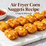 Air fryer corn nuggets with crispy golden breading, sweet corn kernels, and a crunchy exterior, served with a sweet chili dipping sauce as an easy appetizer or snack.