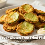 Air fryer gluten free fried pickles with crispy golden breading, tangy pickle slices, fresh dill, and a creamy dipping sauce, served as an easy gluten free appetizer.