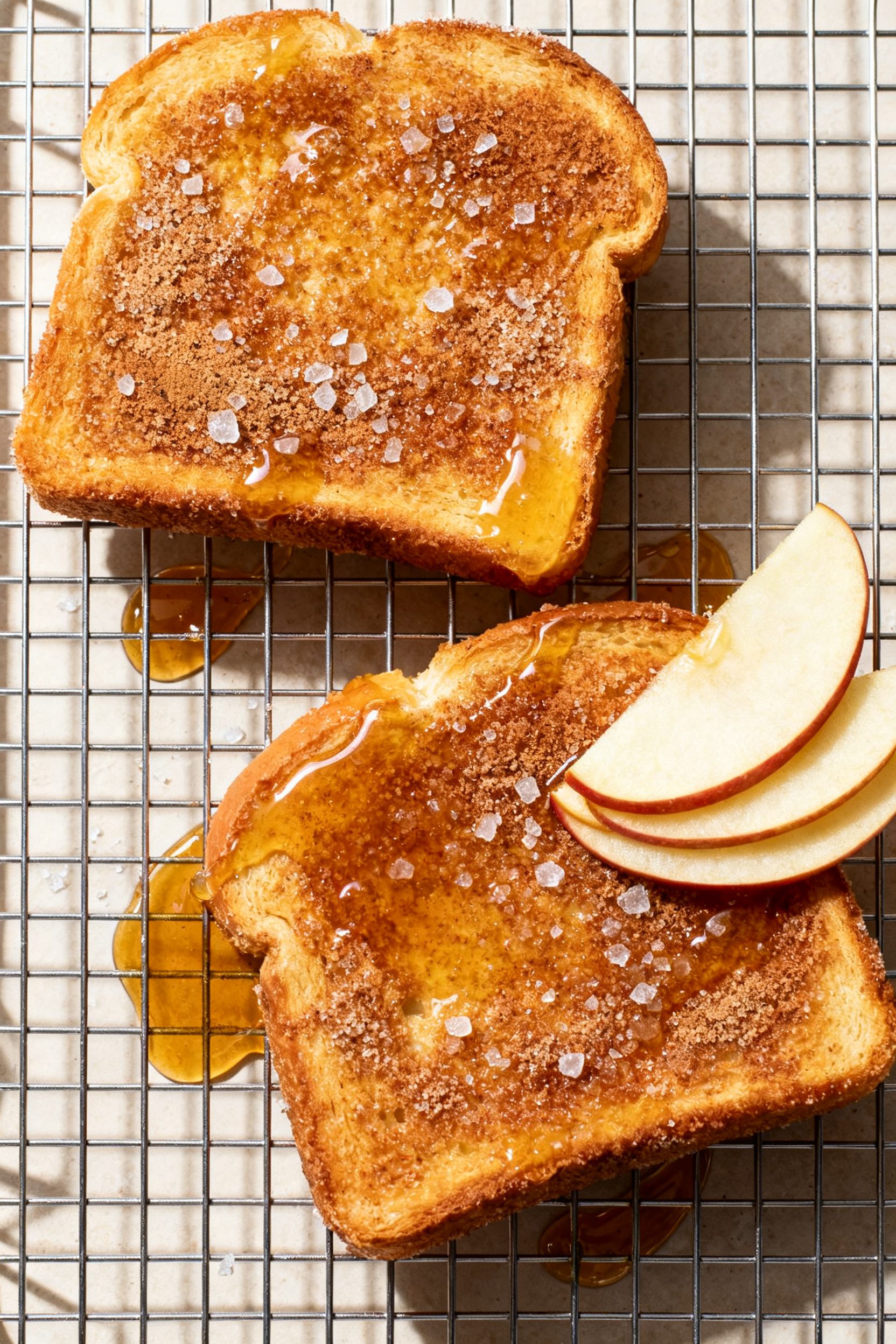 Tasty top view sweet variation: Overhead shot of two slices of air-fried brioche fried bread on a co